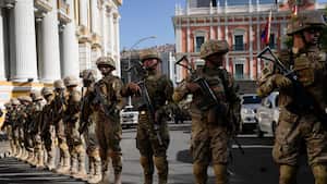 Soldiers block the street in front of the presidential palace, right, and the Legislative Assembly, left, in Plaza Murillo in La Paz, Bolivia, Wednesday, June 26, 2024. (AP Photo/Juan Karita)