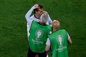 France's midfielder #07 Antoine Griezmann receives treatment during the UEFA Euro 2024 Group D football match between Austria and France at the Duesseldorf Arena in Duesseldorf on June 17, 2024. (Photo by KENZO TRIBOUILLARD / AFP)
