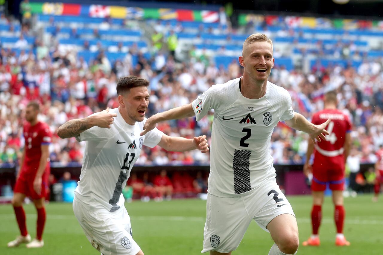 MUNICH, GERMANY - JUNE 20: Zan Karnicnik of Slovenia celebrates 1-0 with Erik Janza of Slovenia  during the  EURO match between Slovenia  v Serbia at the Allianz Arena on June 20, 2024 in Munich Germany (Photo by Damjan Zibert/Soccrates/Getty Images)