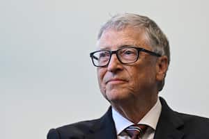 FILE PHOTO: Microsoft founder Bill Gates reacts during a visit with Britain's Prime Minister Rishi Sunak of the Imperial College University, in London, Britain, February 15, 2023. Justin Tallis//Pool via REUTERS/File Photo