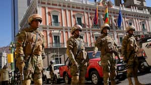 Soldiers stand guard outside the presidential palace in Plaza Murillo in La Paz, Bolivia, Wednesday, June 26, 2024. (AP Photo/Juan Karita)