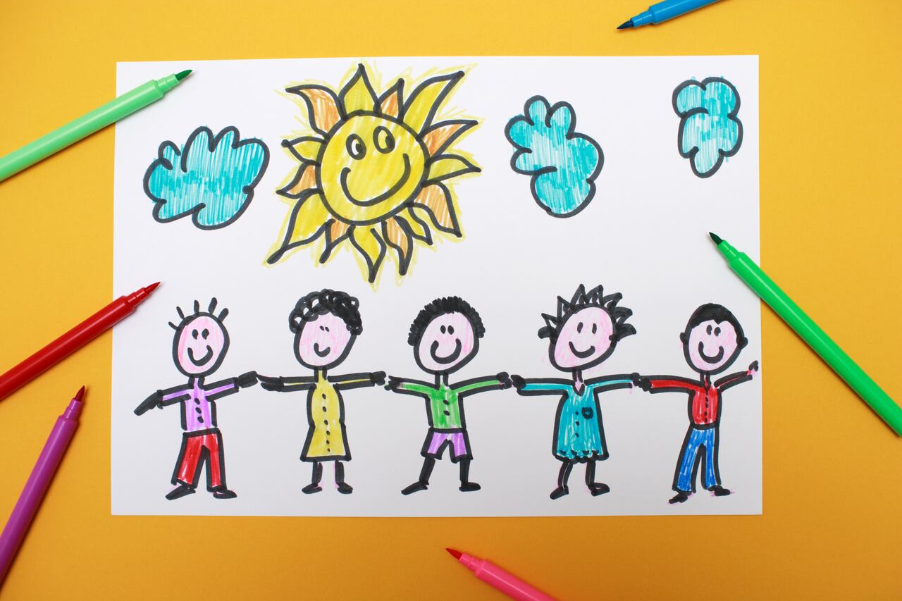 A young kid's drawing of five young children holding hands and smiling in the sunshine.