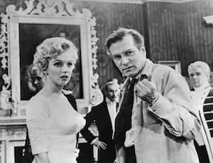 (FILES) Film director Laurence Olivier directs US actress Marilyn Monroe on August 14, 1956 during the filming of "The Prince and the Showgirl" at Pinewood's studios near London. The Los Angeles home where Marilyn Monroe died was declared a historic landmark on June 26, 2024, thwarting plans by its current owners to demolish the property. (Photo by AFP)