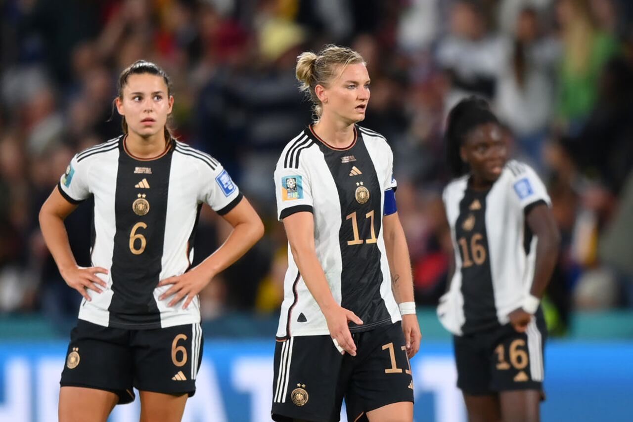 BRISBANE, AUSTRALIA - AUGUST 03: Lena Oberdorf and Alexandra Popp of Germany look dejected after the team's elimination from the tournament during the FIFA Women's World Cup Australia & New Zealand 2023 Group H match between South Korea and Germany at Brisbane Stadium on August 03, 2023 in Brisbane, Australia. (Photo by Justin Setterfield/Getty Images)