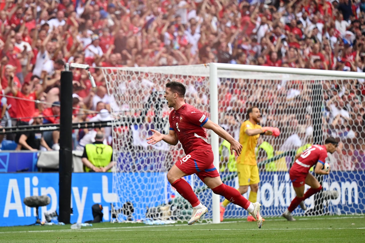 MUNICH, GERMANY - JUNE 20: Luka Jovic of Serbia celebrates scoring his team's first goal during the UEFA EURO 2024 group stage match between Slovenia and Serbia at Munich Football Arena on June 20, 2024 in Munich, Germany. (Photo by Sebastian Widmann - UEFA/UEFA via Getty Images)