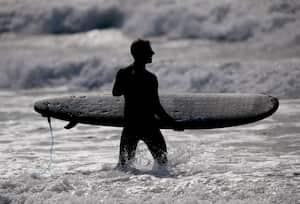 PACIFICA, CALIFORNIA - JUNE 15:  A surfer enters the water at Linda Mar Beach in Pacifica, Calif., on Wednesday, June 15, 2023. This was one of the beaches which made Heal the Bays annual beach report for bad water quality. (Jane Tyska/Digital First Media/The Mercury News via Getty Images)