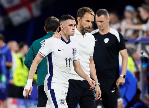 FILE PHOTO: Soccer Football - Euro 2024 - Group C - England v Slovenia - Cologne Stadium, Cologne, Germany - June 25, 2024  England's Phil Foden with manager Gareth Southgate after being substituted REUTERS/Wolfgang Rattay/File Photo